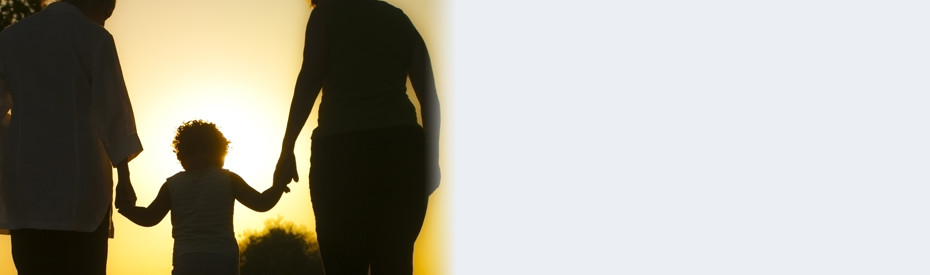 Silhouette of a person walking with a bright light background.